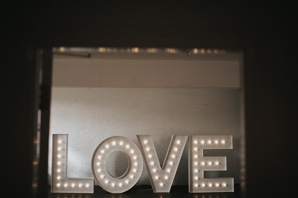 Large marquee light up letters of the word LOVE in modern font