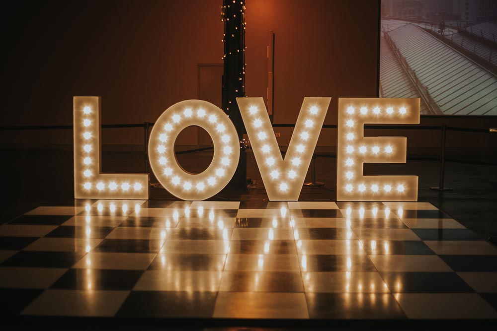 Shiny reflections of the word LOVE in light up letters from Ray of Light Letters, Lincolnshire and Yorkshire